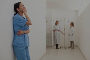 Nurse in distress in hallway
