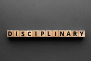 Disciplinary spelled out with blocks