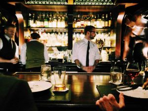 Bartenders at a busy bar