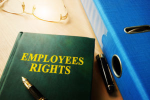 employee rights handbook with pen