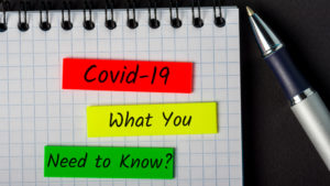 notebook with pen talking about covid-19