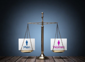 scale of justice with men and women notecards