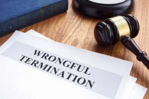 wrongful termination paperwork with gavel