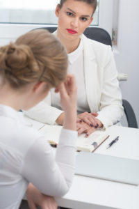 Two women talking and one is frustrated 