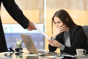 Woman in shock receiving paper 