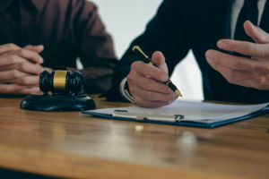 Man taking notes at desk